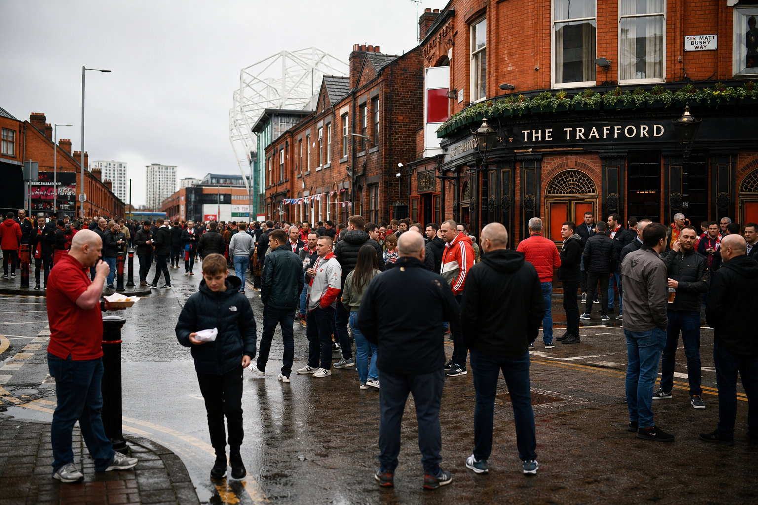 United fans in red scarves walking toward Old Trafford before kick-off