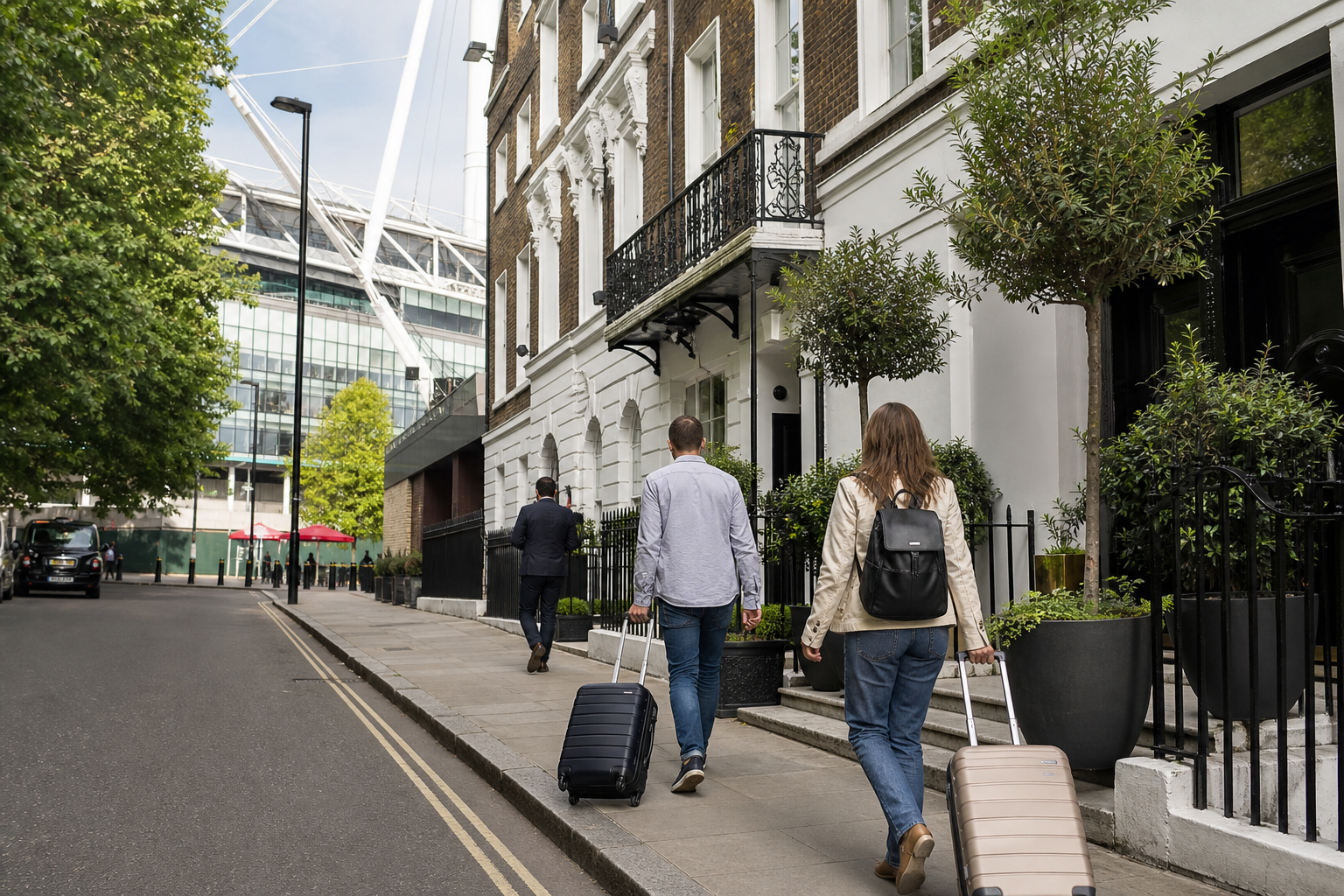 Islington or Holloway street near Emirates with travellers pulling cabin bags