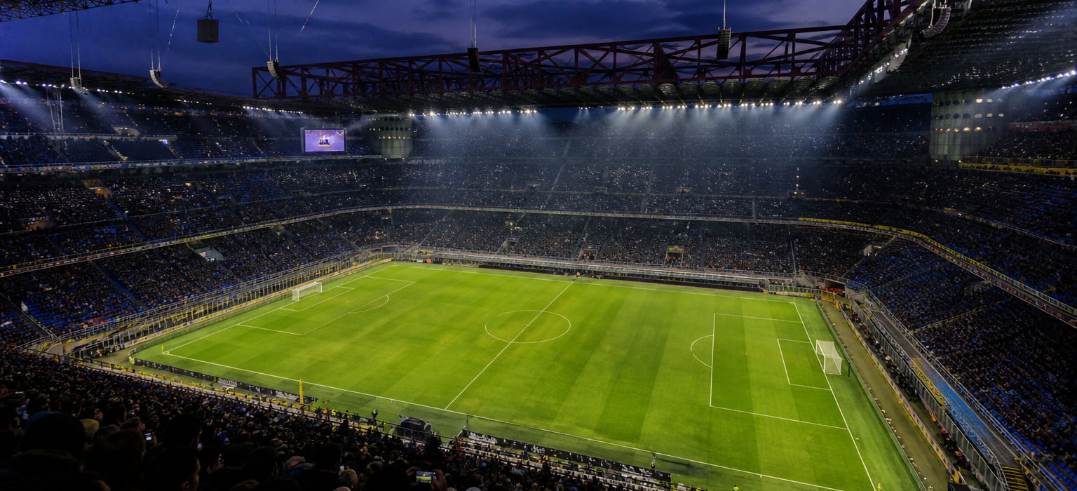 Inside a large Italian stadium bowl with blue-and-black supporters before kick-off